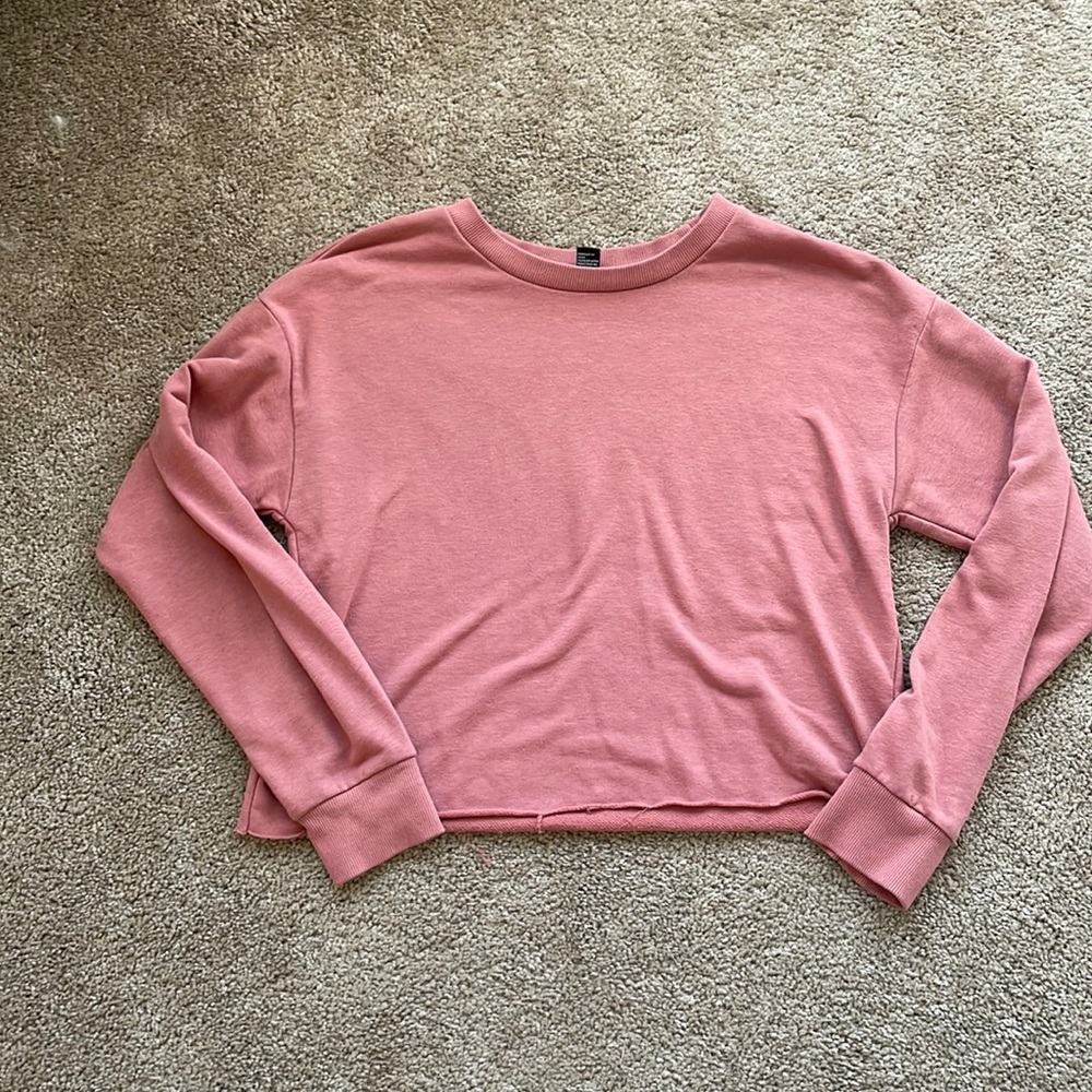 pink semi cropped sweater with fringed bottom